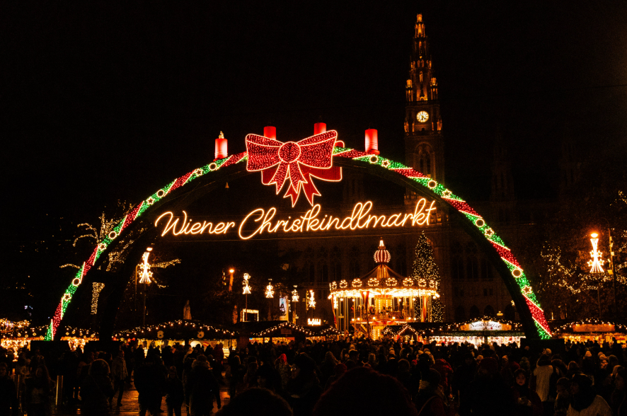 Festive atmosphere at Christkindlmarkt with lights in winter.